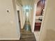 Hallway with wood-look flooring leading to the kitchen, with dark wood cabinets and white appliances at 1059 Sims Sw St, Atlanta, GA 30310