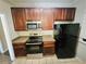 Updated kitchen with stainless steel appliances, black refrigerator, and ample counter space at 1059 Sims Sw St, Atlanta, GA 30310