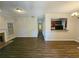 Open-concept living room featuring hardwood floors and access to the kitchen at 1059 Sims Sw St, Atlanta, GA 30310