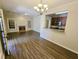 Bright living room with a fireplace, open to the kitchen, and featuring wood-look flooring at 1059 Sims Sw St, Atlanta, GA 30310