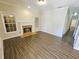 Bright living room with hardwood floors, fireplace, and windows at 1059 Sims Sw St, Atlanta, GA 30310