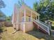 Side view of house with a porch, stairs, and foundation at 1059 Sims Sw St, Atlanta, GA 30310
