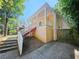 Exterior image of the home's side showing the elevated structure and long porch at 1059 Sims Sw St, Atlanta, GA 30310