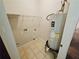 Small utility room with tile floor and water heater at 1059 Sims Sw St, Atlanta, GA 30310