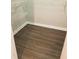 A well-organized walk-in closet features wire shelving and wood-look flooring at 1059 Sims Sw St, Atlanta, GA 30310