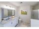 Clean bathroom featuring a marble countertop vanity, shower, and neutral decor at 2196 Sandell Sw Trl, Marietta, GA 30008