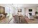 Inviting dining room featuring a large wooden table, elegant chandelier, and views into the living area at 2196 Sandell Sw Trl, Marietta, GA 30008
