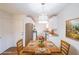 Charming eat-in kitchen with white cabinets, stainless steel appliances, and wood table at 2196 Sandell Sw Trl, Marietta, GA 30008