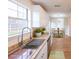 Modern kitchen featuring stainless steel sink, granite counters, and white cabinets at 2196 Sandell Sw Trl, Marietta, GA 30008