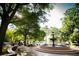 A park square with greenery and a water fountain centerpiece at 2196 Sandell Sw Trl, Marietta, GA 30008