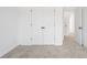 Bright bedroom with neutral carpet, white walls, and a double-door closet offering ample storage at 3186 Eastham Run Dr, Dacula, GA 30019