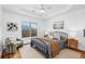 Bright bedroom featuring a tray ceiling, ceiling fan, natural light and stylish furnishings at 655 Mead Se St # 59, Atlanta, GA 30312