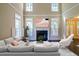 Inviting living room with fireplace, neutral decor, and plenty of natural light at 2088 Hedgewood Trce, Lawrenceville, GA 30043