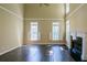 Sun-filled living room with soaring ceilings, large windows, and a fireplace at 2088 Hedgewood Trce, Lawrenceville, GA 30043