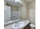 Bathroom featuring a white single sink vanity with dark wood cabinets and tile flooring at 3082 Cedar Glade Ne Ln, Buford, GA 30519