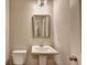 Bathroom featuring a pedestal sink and toilet at 3082 Cedar Glade Ne Ln, Buford, GA 30519