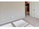 The bedroom has plush carpet, a double-door closet, and large window for natural light at 3082 Cedar Glade Ne Ln, Buford, GA 30519