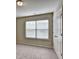 A bright bedroom featuring plush carpeting, a double window and a double door closet at 3082 Cedar Glade Ne Ln, Buford, GA 30519