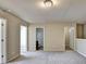 Open area on the second floor featuring carpeted flooring and access to a bathroom at 3082 Cedar Glade Ne Ln, Buford, GA 30519