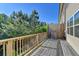 Outdoor deck with wood railings offering a pleasant outdoor space and view of mature trees at 3082 Cedar Glade Ne Ln, Buford, GA 30519