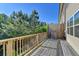Wooden deck with railings offers a pleasant outdoor space with views of backyard trees at 3082 Cedar Glade Ne Ln, Buford, GA 30519