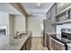 Well-equipped kitchen with a granite-topped island and stainless steel appliances at 3082 Cedar Glade Ne Ln, Buford, GA 30519