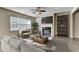 Cozy living room with stylish decor, a fireplace, and ample seating space at 3082 Cedar Glade Ne Ln, Buford, GA 30519