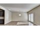 Bright living room featuring neutral walls and doors to the back deck at 3082 Cedar Glade Ne Ln, Buford, GA 30519