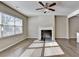 Bright and spacious living room with hardwood floors, fireplace, and plenty of sunlight at 3082 Cedar Glade Ne Ln, Buford, GA 30519
