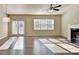 Bright and spacious living room with hardwood floors, fireplace, and natural light at 3082 Cedar Glade Ne Ln, Buford, GA 30519