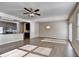 Open-concept living room with an adjacent kitchen and hardwood floors at 3082 Cedar Glade Ne Ln, Buford, GA 30519