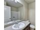 A well-lit bathroom featuring a large mirror, sink, countertop, and a toilet at 3082 Cedar Glade Ne Ln, Buford, GA 30519