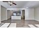 Open concept living room with hardwood floors connected to a modern kitchen at 3082 Cedar Glade Ne Ln, Buford, GA 30519