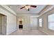 Main bedroom showcasing a bathroom doorway and walk in closet with custom shelving at 3082 Cedar Glade Ne Ln, Buford, GA 30519