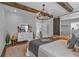 Bright and airy main bedroom with wooden beams, a modern chandelier, and view to an ensuite at 127 Old Alabama Road Se, Emerson, GA 30137