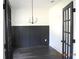Modern office with dark accent wall, wainscoting, and glass paneled French doors for a professional touch at 127 Old Alabama Se Rd, Emerson, GA 30137