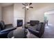 Spacious living room with ample seating, a cozy fireplace, and neutral color palette at 1743 Wee Kirk Se Rd, Atlanta, GA 30316
