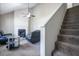 Cozy living room with a fireplace, modern ceiling fan, and contemporary black furniture at 1743 Wee Kirk Se Rd, Atlanta, GA 30316