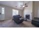 Inviting living room with natural light, fireplace, modern fan, and comfortable seating at 1743 Wee Kirk Se Rd, Atlanta, GA 30316