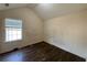 Light-filled bedroom with neutral walls and wood-look flooring at 2625 Thunder Basin Way, Douglasville, GA 30135