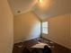 Spacious bedroom with vaulted ceilings and natural light from a single window at 2625 Thunder Basin Way, Douglasville, GA 30135