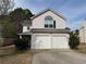 Two-story home featuring an attached two-car garage and a well-maintained front yard at 2625 Thunder Basin Way, Douglasville, GA 30135