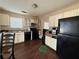 Functional kitchen featuring sleek black appliances and ample cabinet space at 2625 Thunder Basin Way, Douglasville, GA 30135