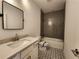 Full bath features a grey tiled tub and shower combination and decorative tile floor at 3794 Allegretto Cir, Atlanta, GA 30339
