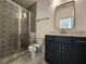Well-appointed bathroom with patterned tile shower and a modern vanity at 3794 Allegretto Cir, Atlanta, GA 30339