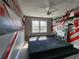 Upstairs podcast-themed bedroom with unique wall designs and a tiered platform bed, ready for creativity at 3794 Allegretto Cir, Atlanta, GA 30339