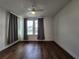 Well-lit bedroom featuring hardwood floors and plenty of natural light at 3794 Allegretto Cir, Atlanta, GA 30339