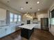 Modern kitchen with stainless steel appliances, white cabinets, and a large island at 3794 Allegretto Cir, Atlanta, GA 30339