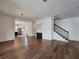 Spacious living room with hardwood flooring, modern lighting, and open floor plan at 3794 Allegretto Cir, Atlanta, GA 30339