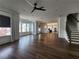 Hardwood floors throughout this open floor plan with modern lighting and bright windows at 3794 Allegretto Cir, Atlanta, GA 30339